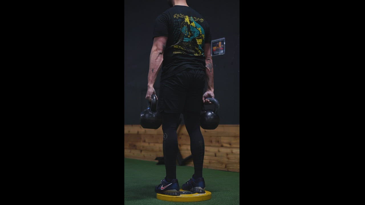 Trap bar deadlift with KBs