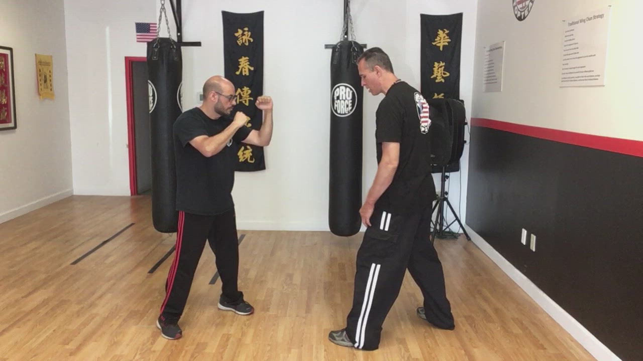 Scooping defense against straight kick and knee